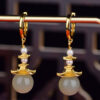 S925 Silver Inlaid Hetian Jade Ancient Building Pearl Earrings