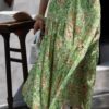 Curved pleated ramie skirt with green grass and flowers