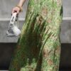 Curved pleated ramie skirt with green grass and flowers