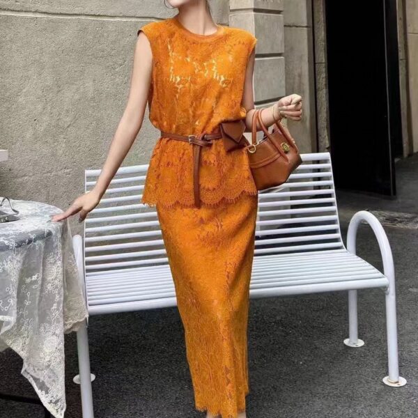Hollow vest and high-waisted slimming skirt set
