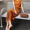Hollow vest and high-waisted slimming skirt set
