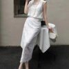 Hollow vest and high-waisted slimming skirt set