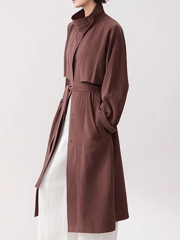 Carbon-negative long trench coat, blockchain-traced silk with plant-based leather buckles