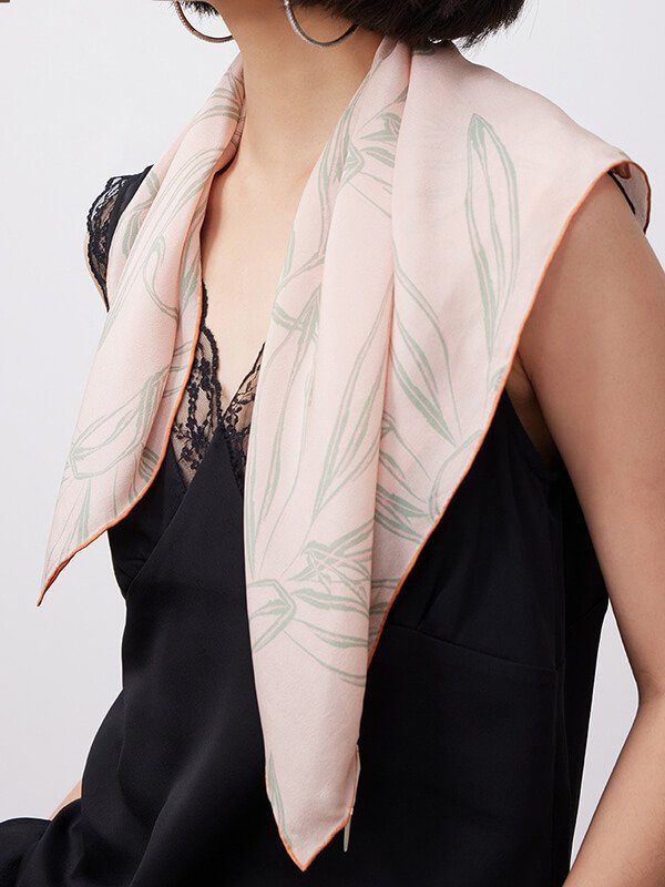 Aromatherapy-infused silk scarf with chromotherapy print, weighted corner for stress relief