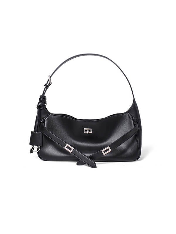 Commuter-proof vintage leather tote bag flat lay, buckle closure with brass hardware