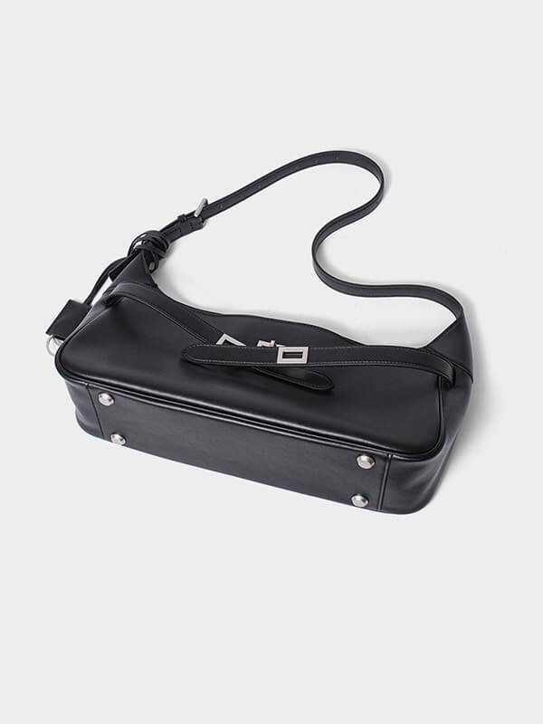 Convertible vintage tote bag for long-haul flights, dual buckle straps as crossbody or backpack