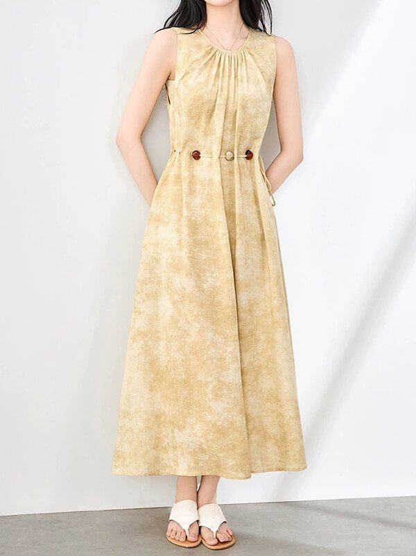 Hand-finished yellow maxi dress with 1940s-inspired shirred bust, Tencel-linen jacquard weave, and French seam construction for heirloom resort wear.